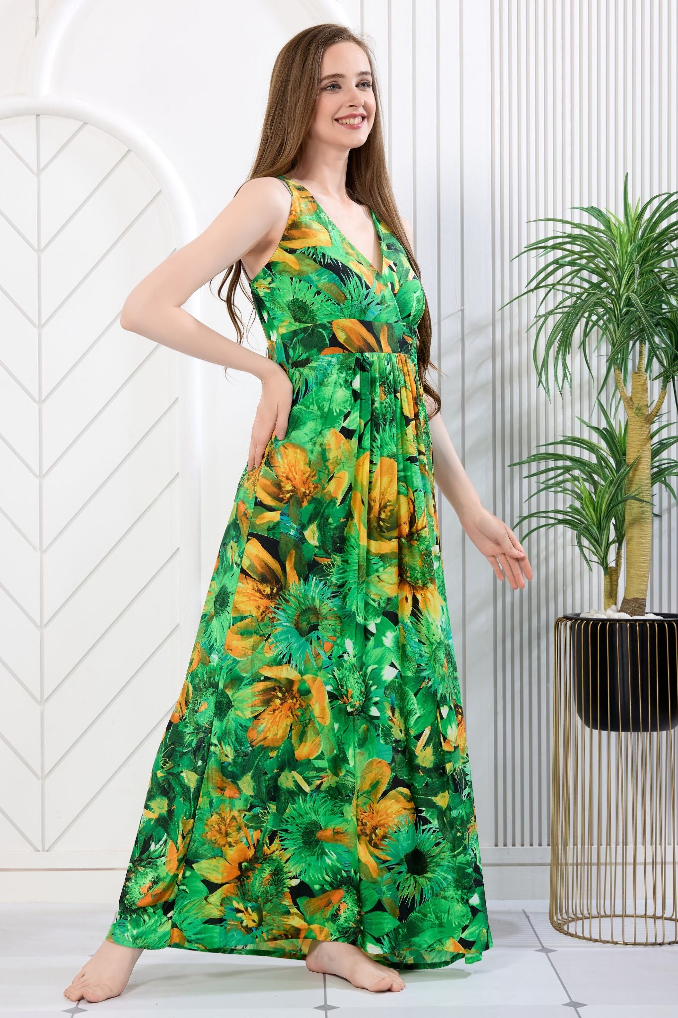 Woman wearing green and orange floral print sleeveless maxi gown - Gemini Nightwears