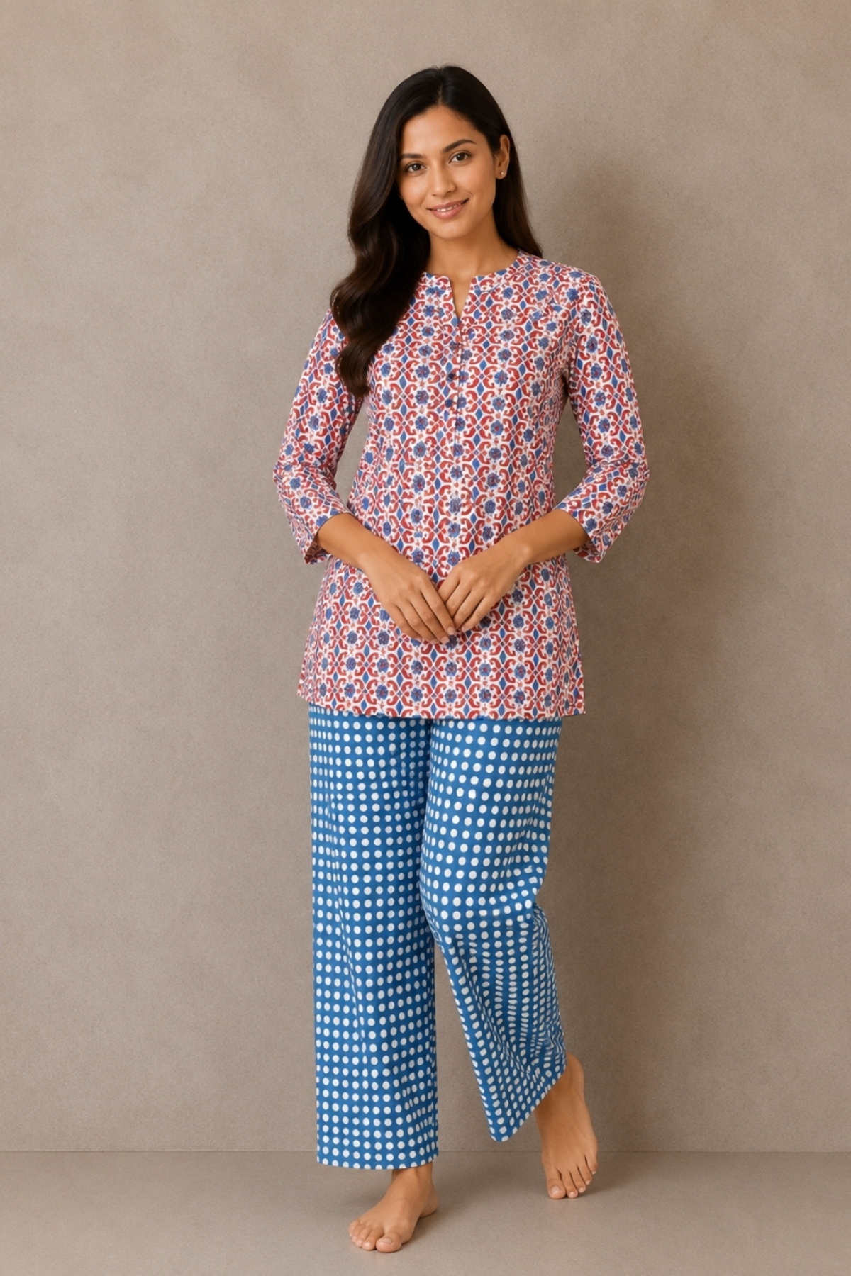 Woman wearing ruby red and blue geometric medallion print co-ord set - Gemini Nightwears