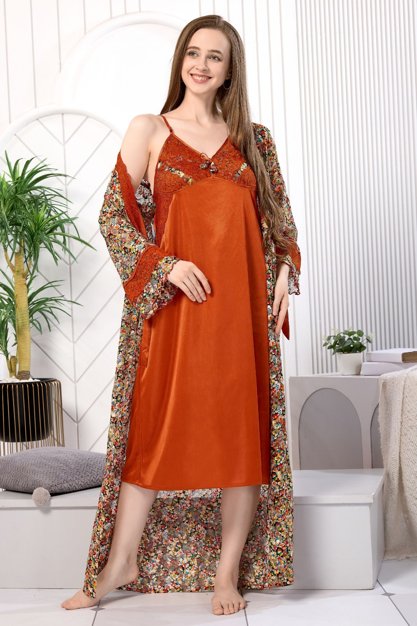 Woman wearing rust orange satin nighty with floral net robe - Gemini Nightwears