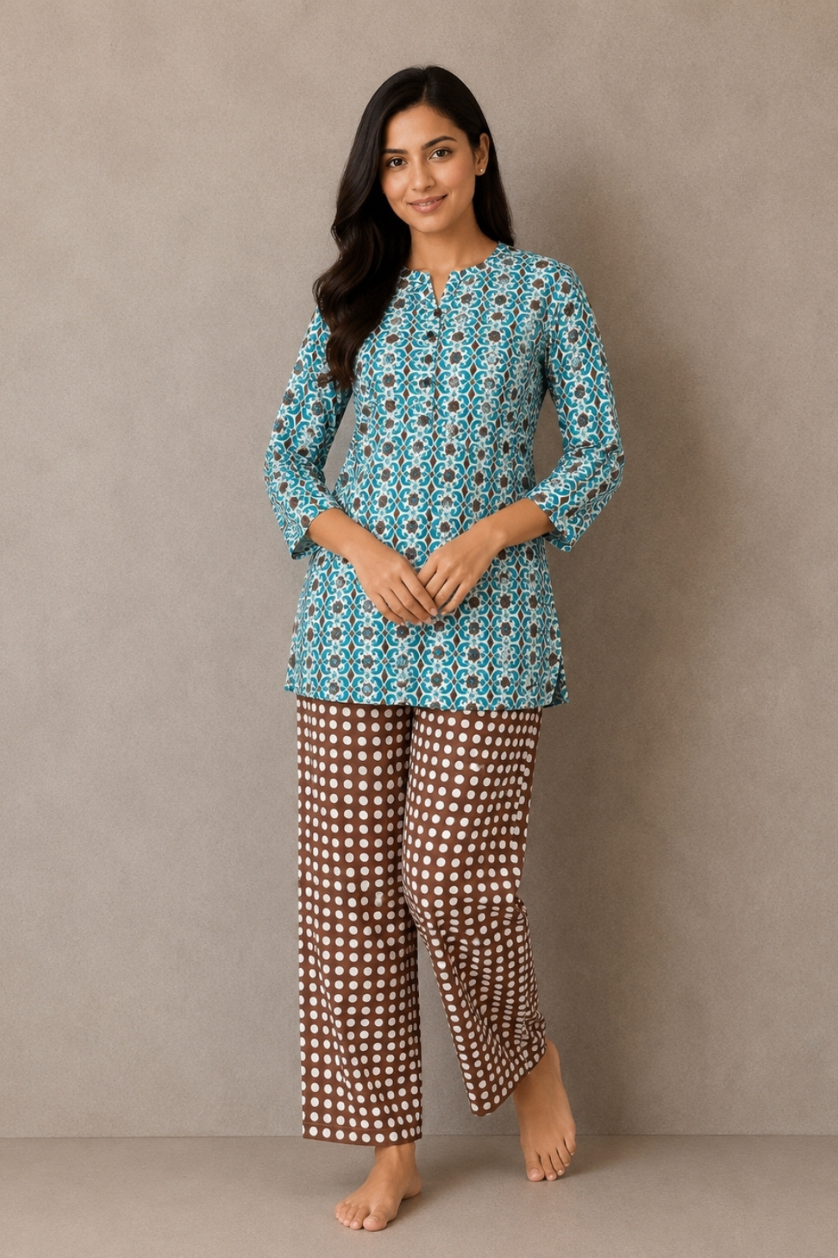 Woman wearing teal and brown geometric medallion print co-ord set - Gemini Nightwears